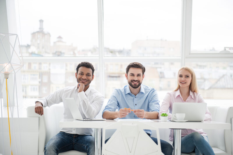 Young creative team of web designers working together to build a website that people can use easily.